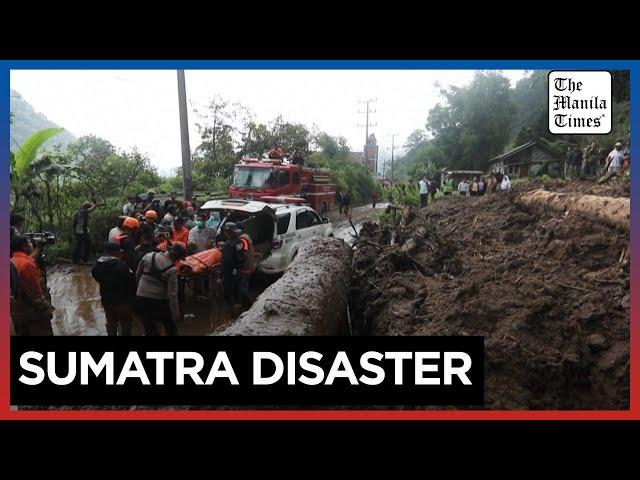 Indonesia digs out as flooding, landslide death toll hits 20