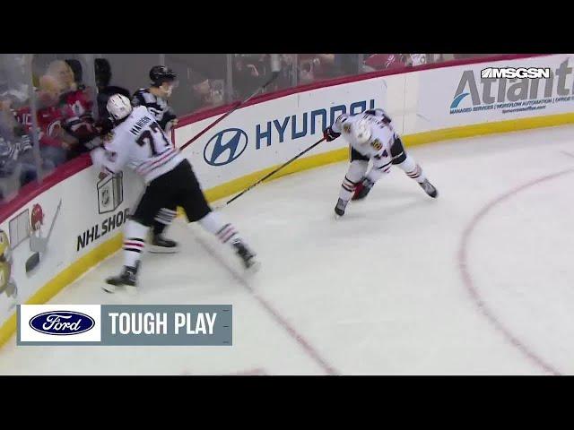 Jack Hughes scores a goal against the Chicago Blackhawks