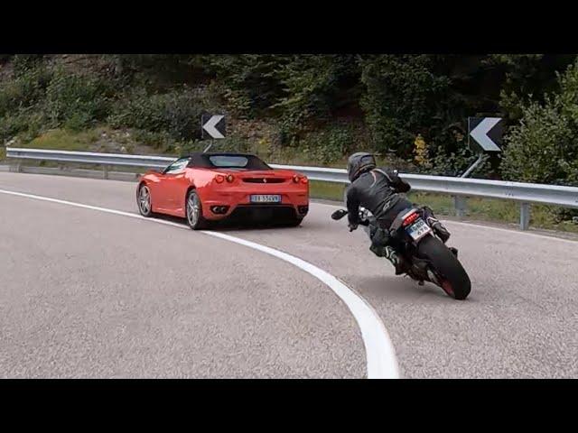 Ducati girl with pigtails chasing Ferrari on SS42 up to passo della Mendola