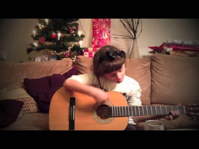 6 years old girl Mia M sings and plays guitar