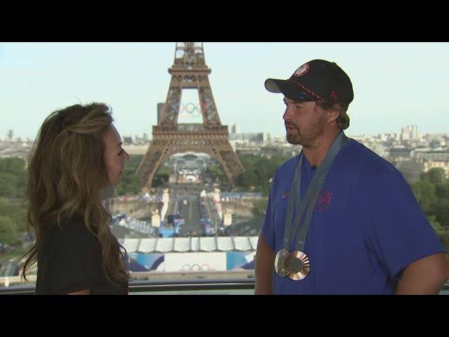 Tram Mai talks with silver-medal archer Brady Ellison