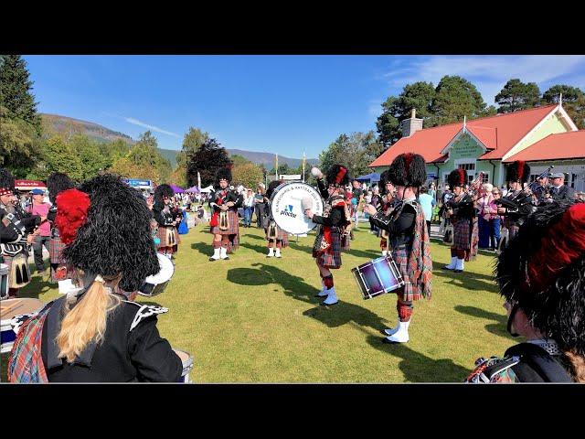 Blairgowrie Pipe Band playing Drunken Piper outside Pavilion during 2024 Braemar Gathering Scotland