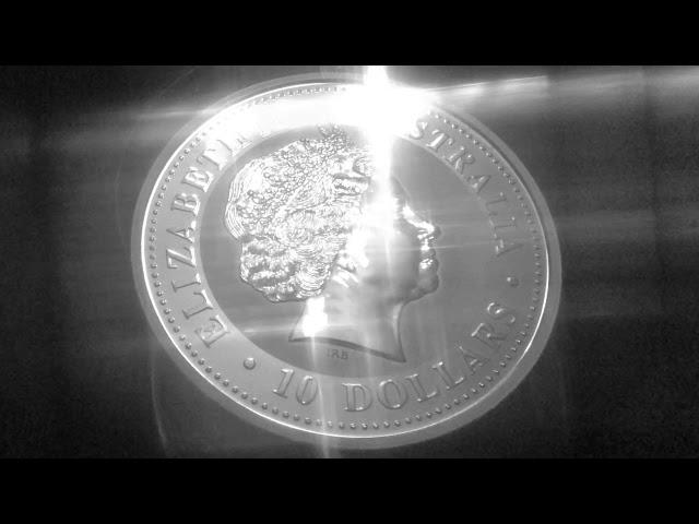 4k Close Up Silver Coin With Cross Glare Shine