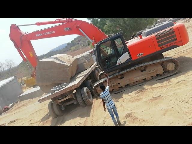 Tata hitachi 370 track loding granite Blocks