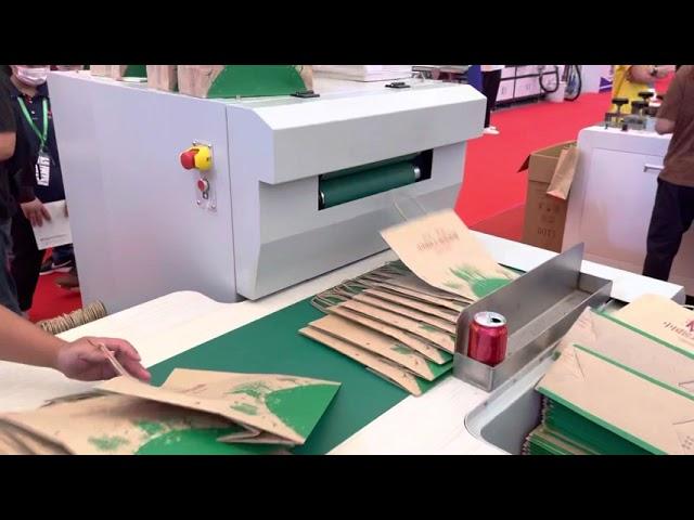 Square bottom paper bag making machine with twisted rope handle