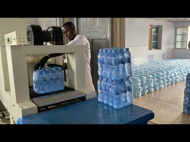 Bottled water production machine producing portable bottled water at the manufacturing factory