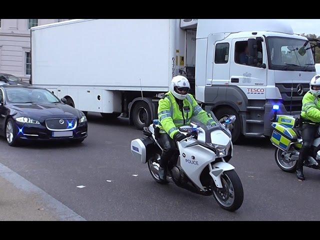 Metropolitan Police Special Escort Group & Traffic Unit escorting a car