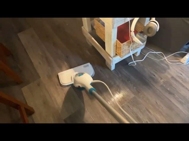 Black and Decker steam mop on luxury vinyl flooring.