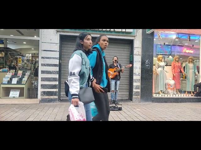 Telented Street musician playing guitar in the streets of downtown Tunis close to Rue de Marseille