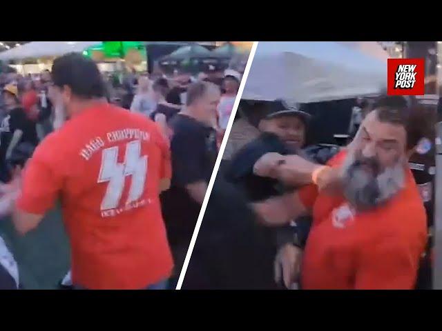 ‘No f**king Nazis!’: Punk-rockers rough up fan wearing SS shirt