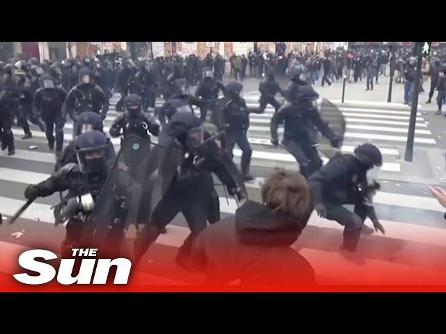 Riot police knock man unconscious during protest in Paris