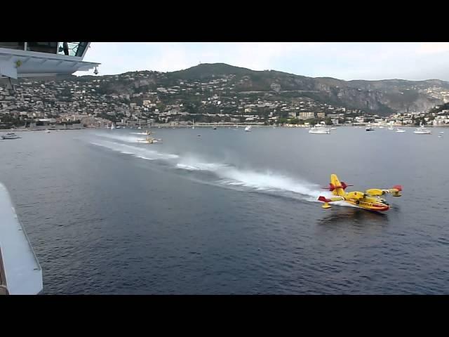 Water Bombers load up next to cruise liner