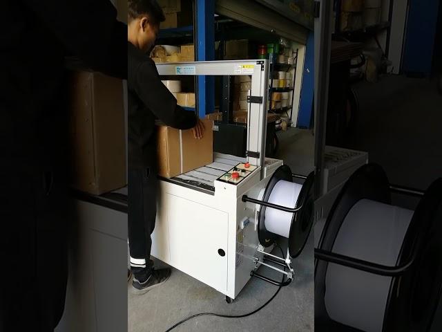 PP hot melt carton strapping machine can be equipped with carton sealing machine