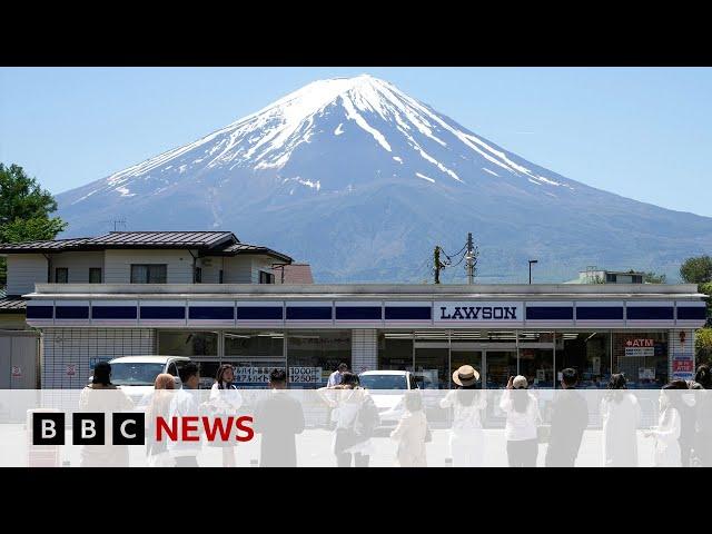 Japanese town blocks iconic Mount Fuji view to deter tourists | BBC News