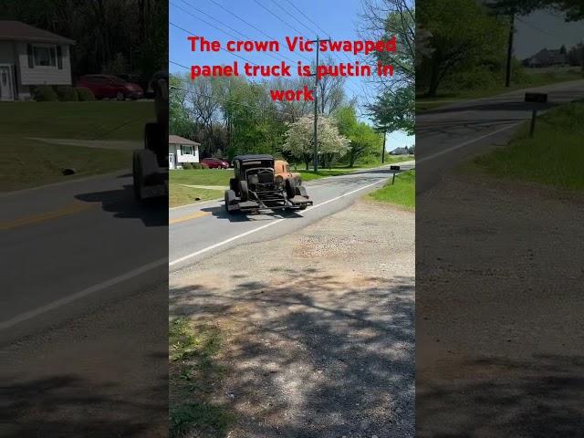 Crown Vic swapped panel truck towing the rat rod