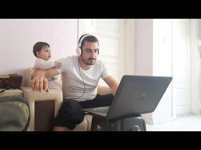 Baby Distracts Dad From Working From Home