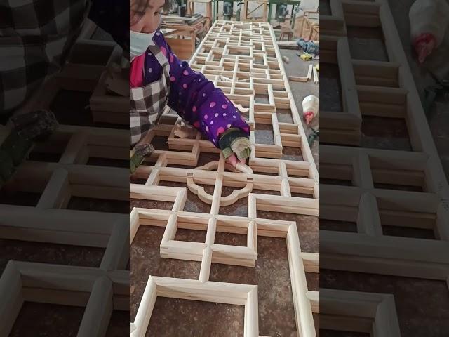 Carpenter demonstrates craftsmanship in making wooden window doors