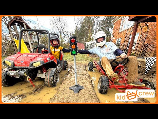 Mud racing kids ride on truck vs. dad's go-kart through mud, jump, and woods. Educational | Kid Crew