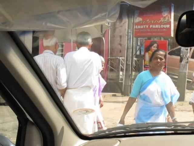 Kerala, India - Men holding hands