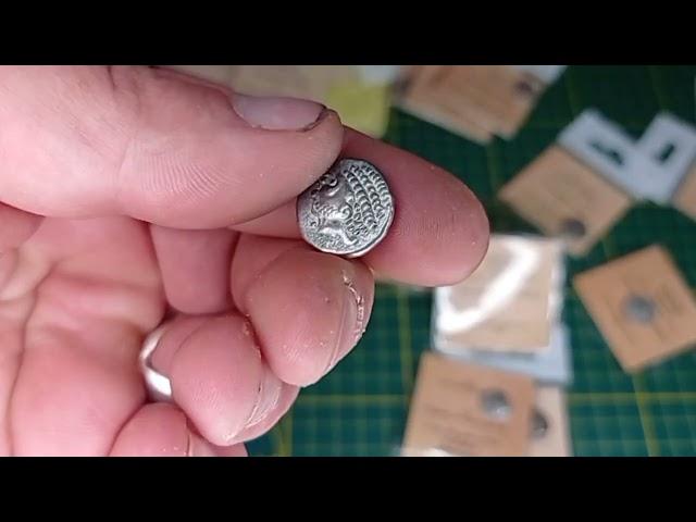 Unboxing replica Celtic coins.