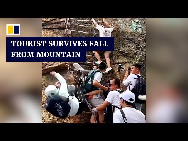 Chinese tourist survives fall from steep mountain steps