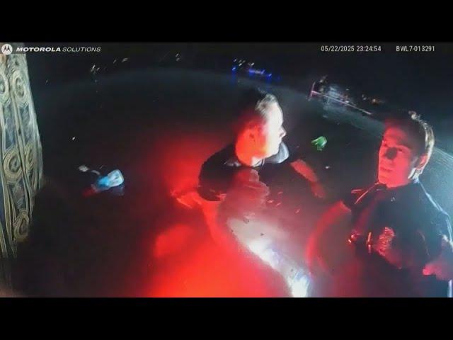 Michigan officers swim out to submerged car to rescue stranded passenger