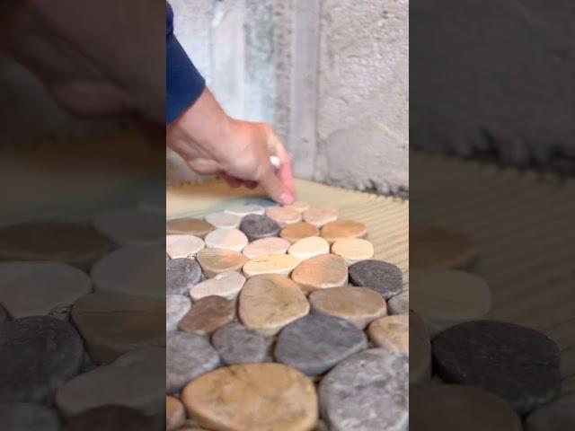 Installing a pebble shower floor #diy #tiling #howto #tile #construction #riverrock #pebbles