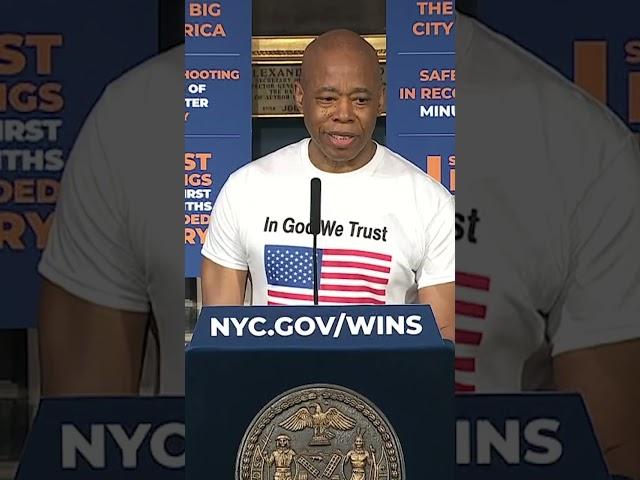 Eric Adams attends weekly press briefing wearing "In God We Trust" t-shirt