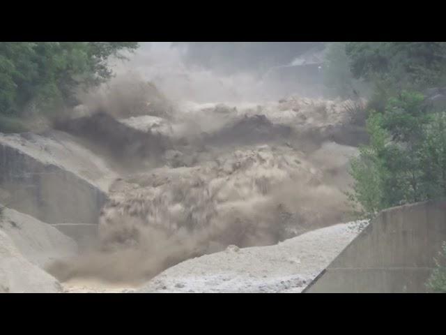 Violent Debris Flow Crashes Down Swiss Alps After Heavy Rainfall