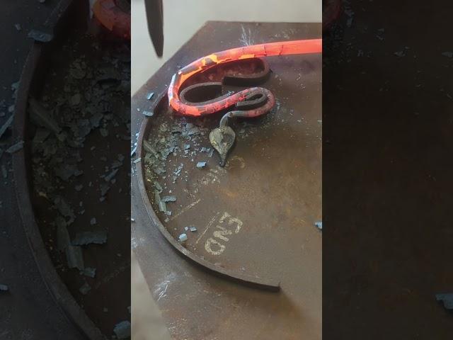 Blacksmith bending steel around a jig.  #blacksmith #satisfying #handmade