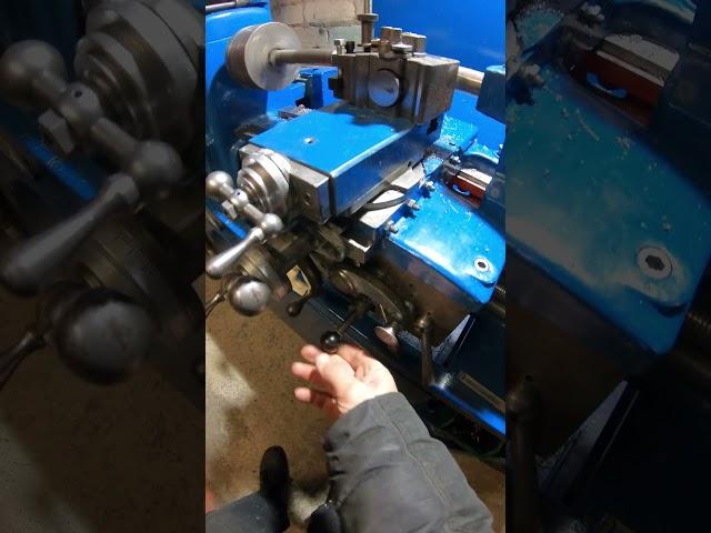 Vintage lathe carriage stop in action