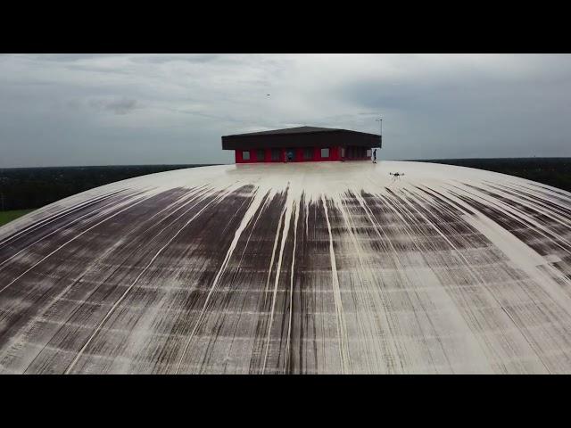 How to clean a dome roof with a spraying drone