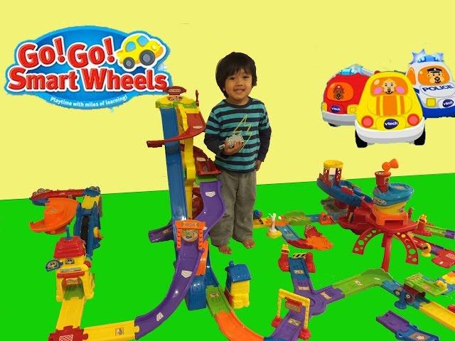 Kid playing with toys Vtech Go Go smart wheels toys