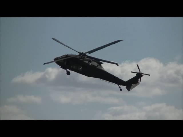 Black hawk and Augusta A109 attack firing guns