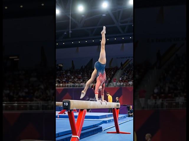 gymnast at the peak of competition   #GymnastInAction  #FemaleAthlete #HighPerformance