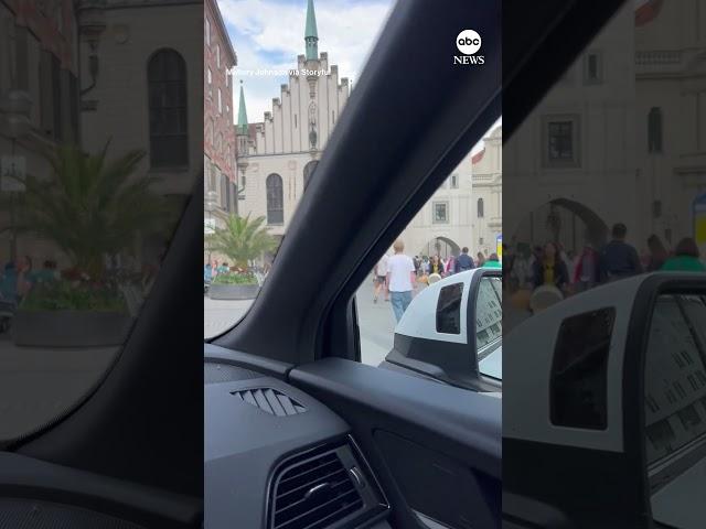 American tourists drive through pedestrian area in Munich