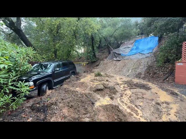 Officials inspect mudslide threatening homes and roads in Northern California