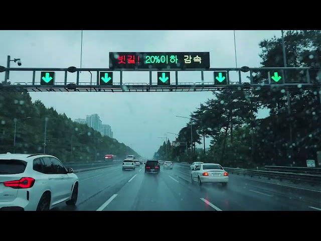 The Gyeongbu Expressway runs endlessly in the pouring rain. I will drive, you travel to dreamland