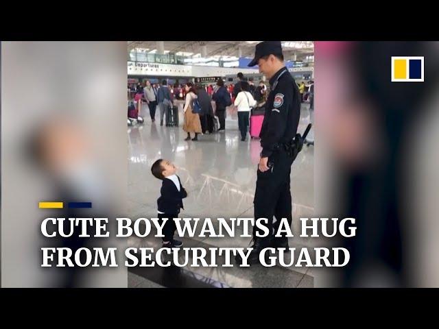 Cute boy wants a hug from security guard