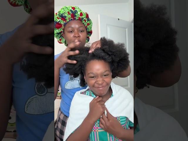 Milan Hair treatment day Using aloe Vera to detangle her hair before washing