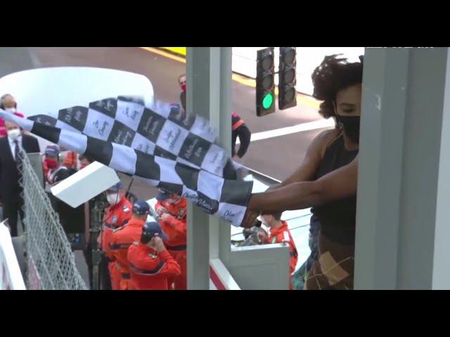 F1 Monaco - Serena Williams struggling to wave the chequered flag.