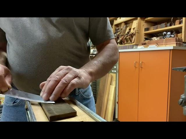 Sharpening a knife on a whetstone