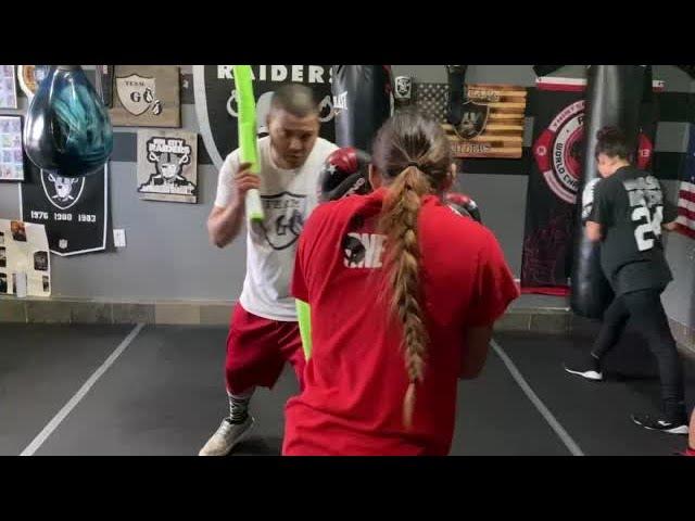 Jackie Garcia trains with pool noodles.