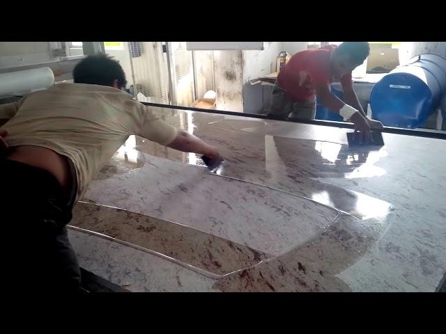 Applying epoxy - polymer to granite slab - India granite processing factory