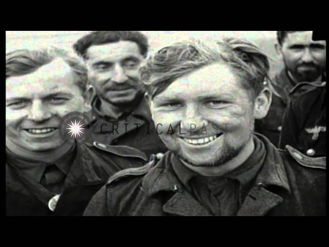 A line of German prisoners marched under US MP (Military Police) guard in Cistern...HD Stock Footage