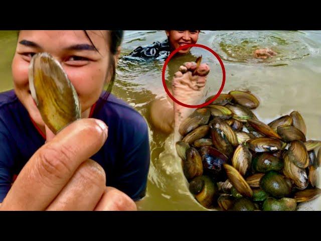 Two girls find Cambodian oysters in the lake