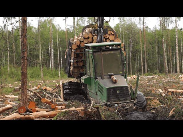 Logging with John Deere, wet forest conditions, big load