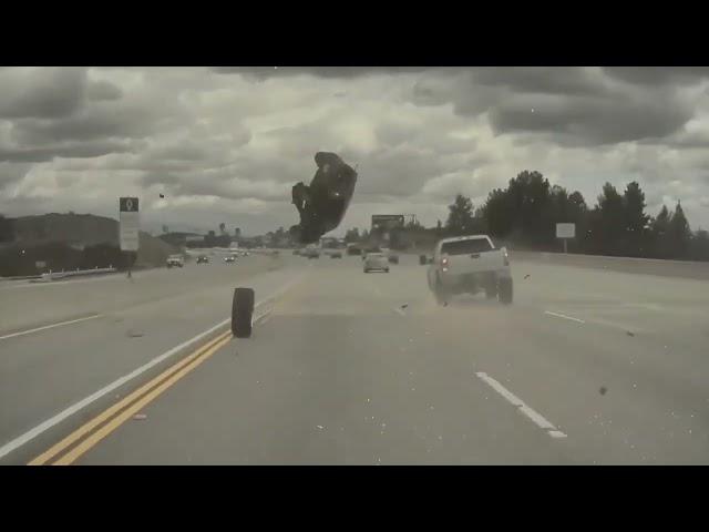 A Kia Soul, launched on a highway by a fallen wheel from a Chevy