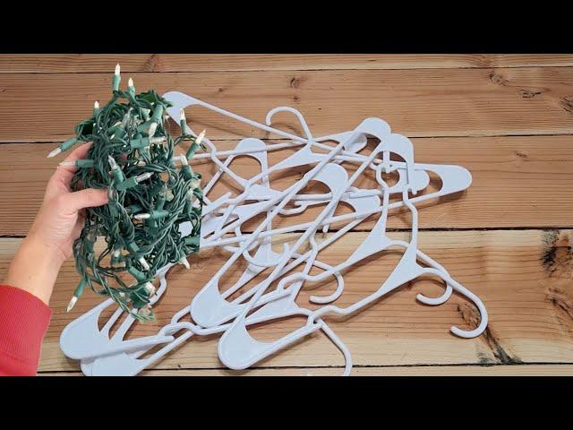 He wraps string lights around a hanger for this BREATHTAKING idea!