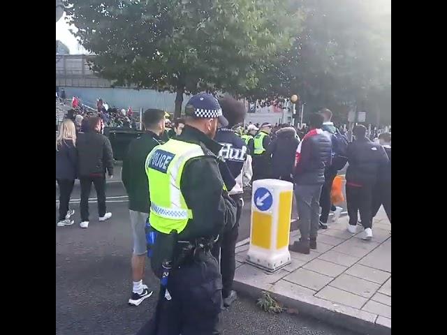 a group of spurs among the arsenal fans